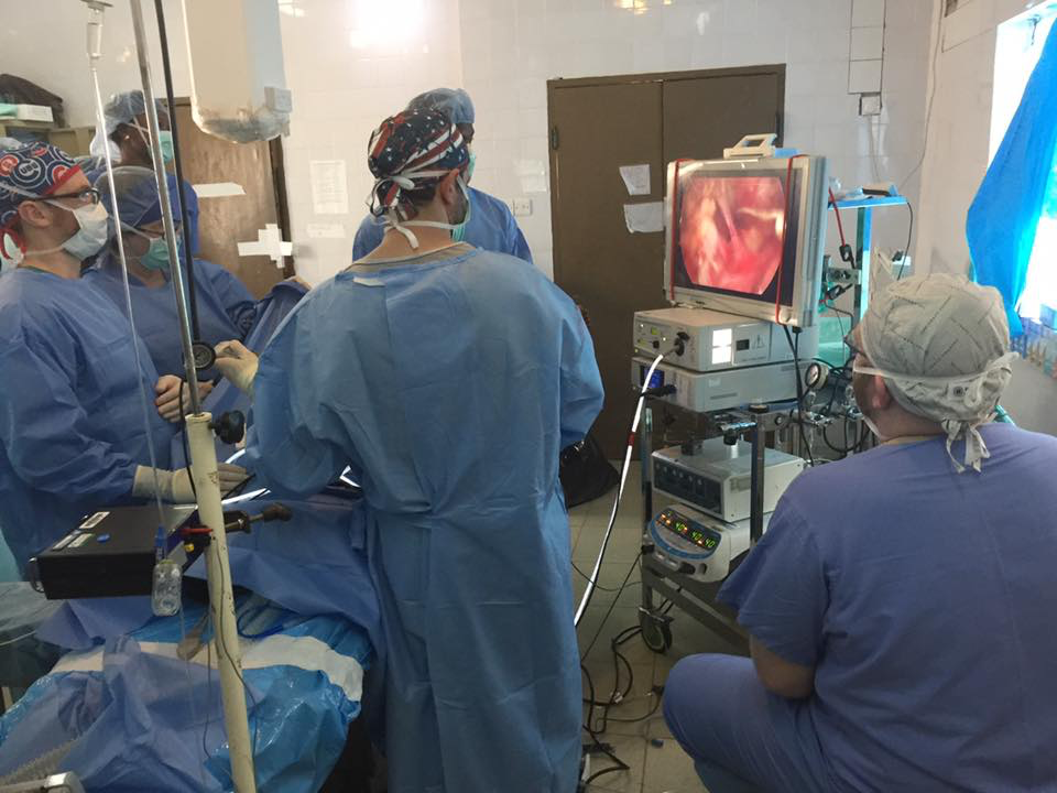 SLI surgical team performing laparoscopic surgery while training local medical personnel